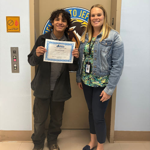 Heayveon Santiago, Jefferson's Stairclimber for October, poses with his award plaque.